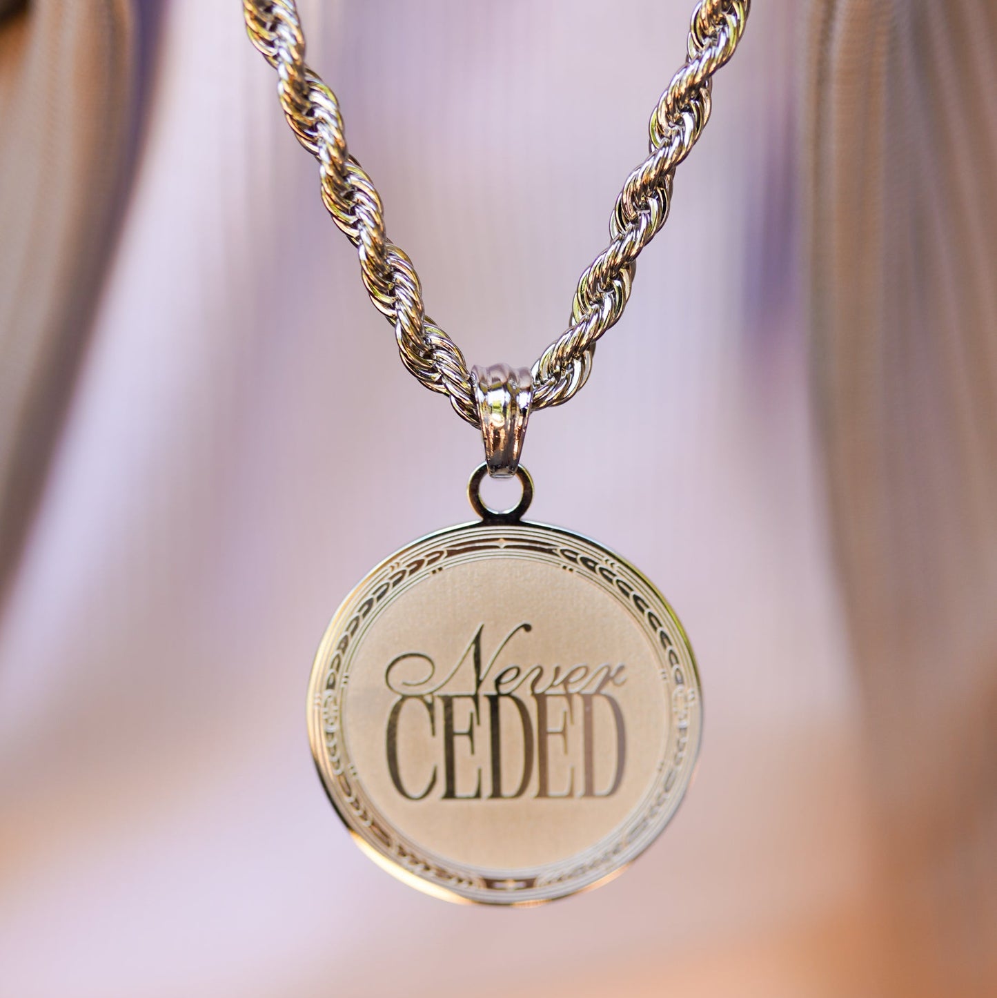 NEVER CEDED MEDALLION NECKLACE