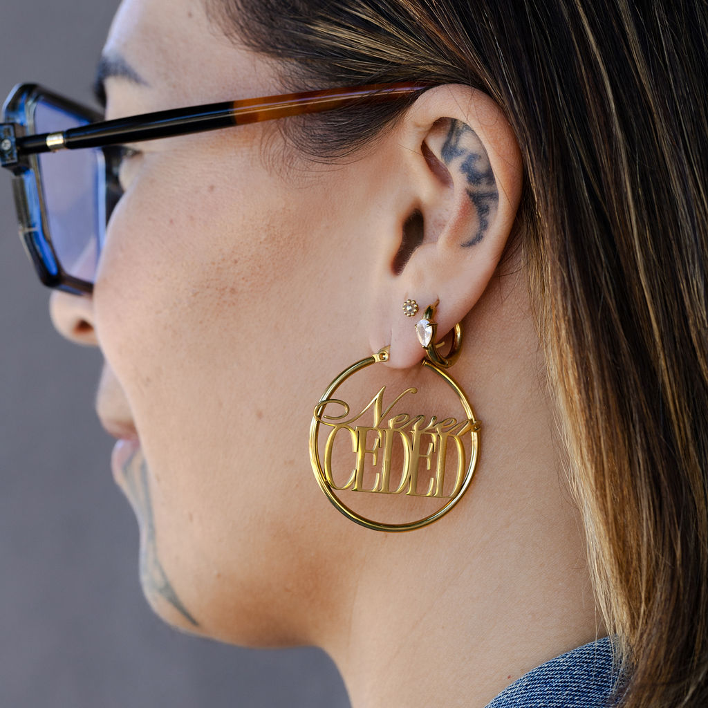 NEVER CEDED HOOP EARRINGS