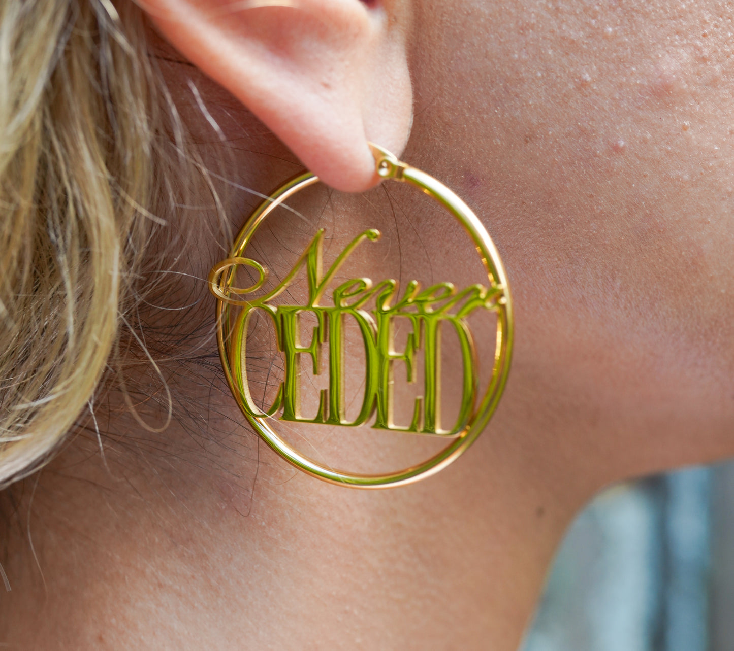 NEVER CEDED HOOP EARRINGS