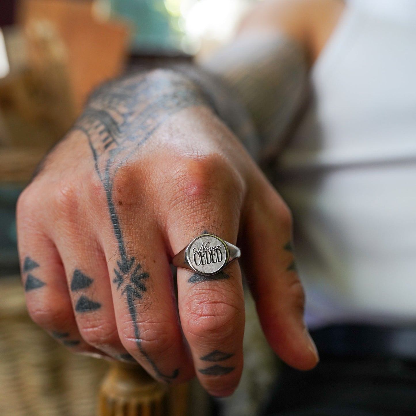 NEVER CEDED SIGNET RING