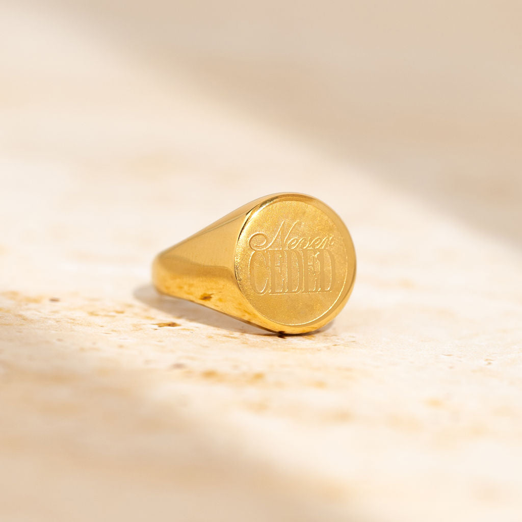 NEVER CEDED SIGNET RING