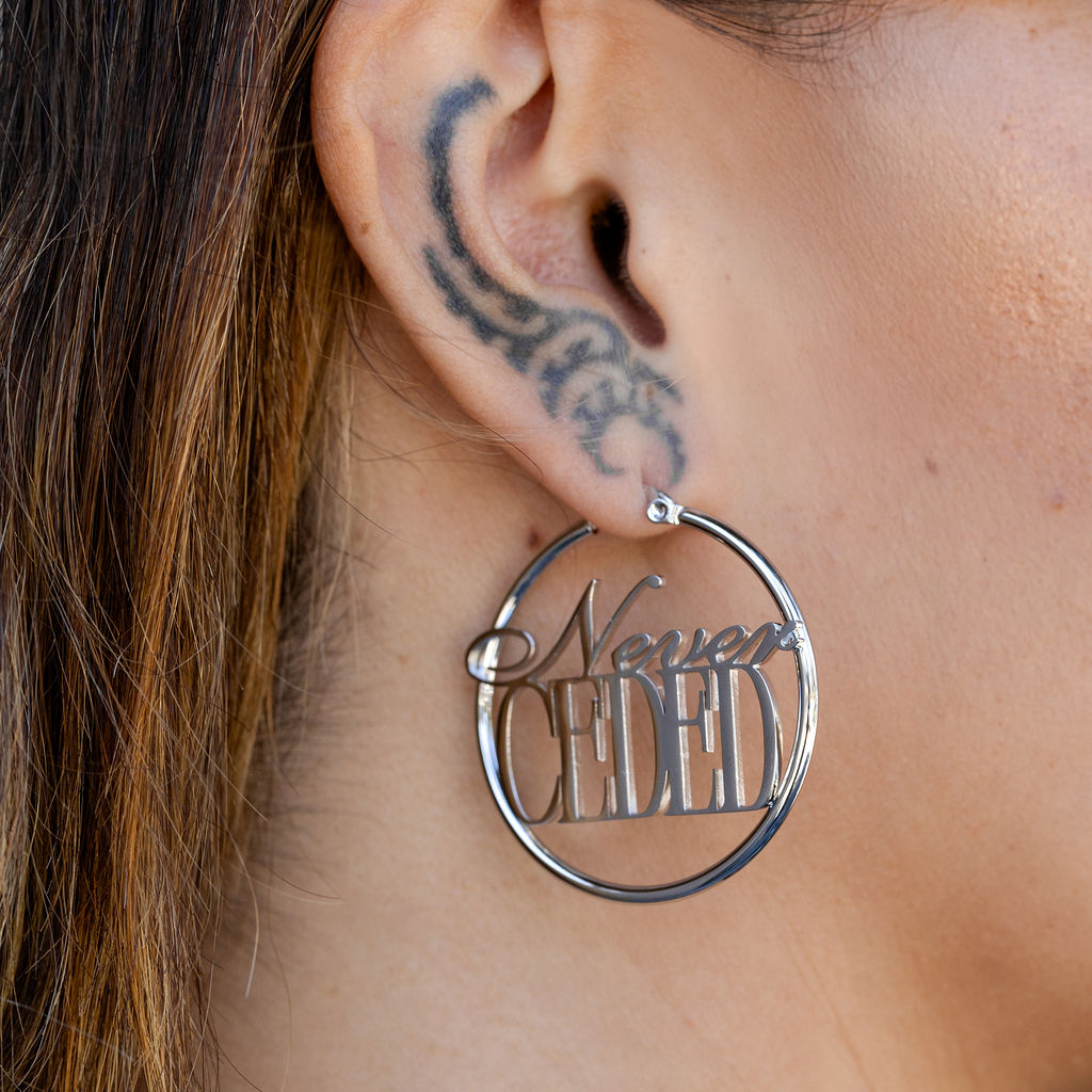 NEVER CEDED HOOP EARRINGS