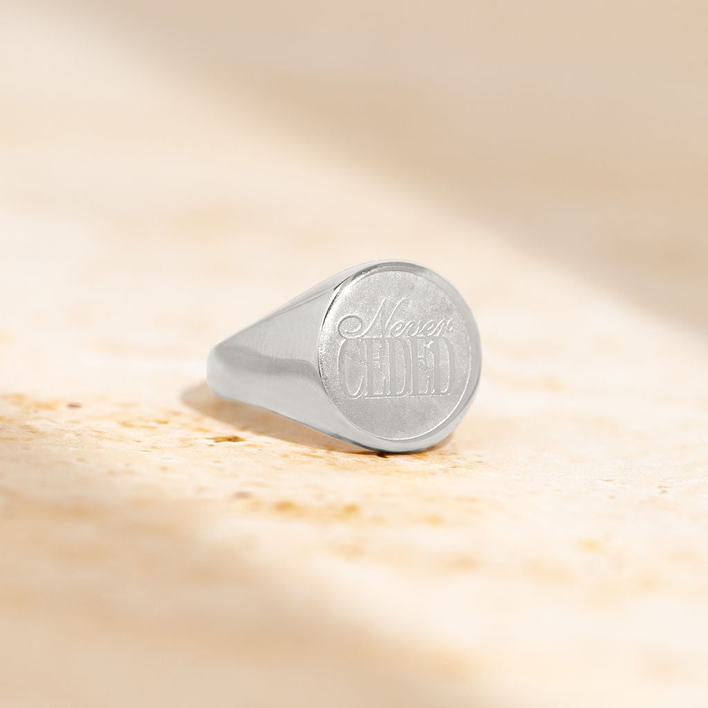 NEVER CEDED SIGNET RING