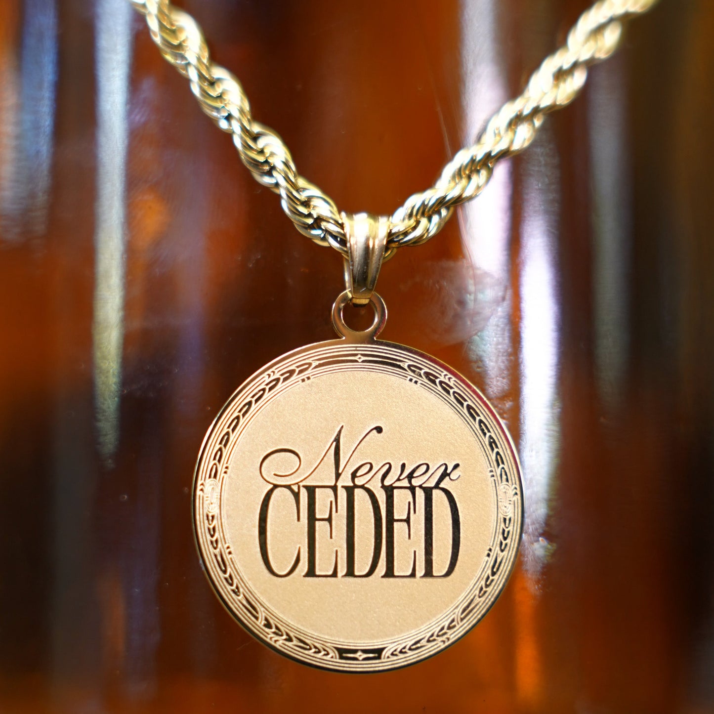 NEVER CEDED MEDALLION NECKLACE