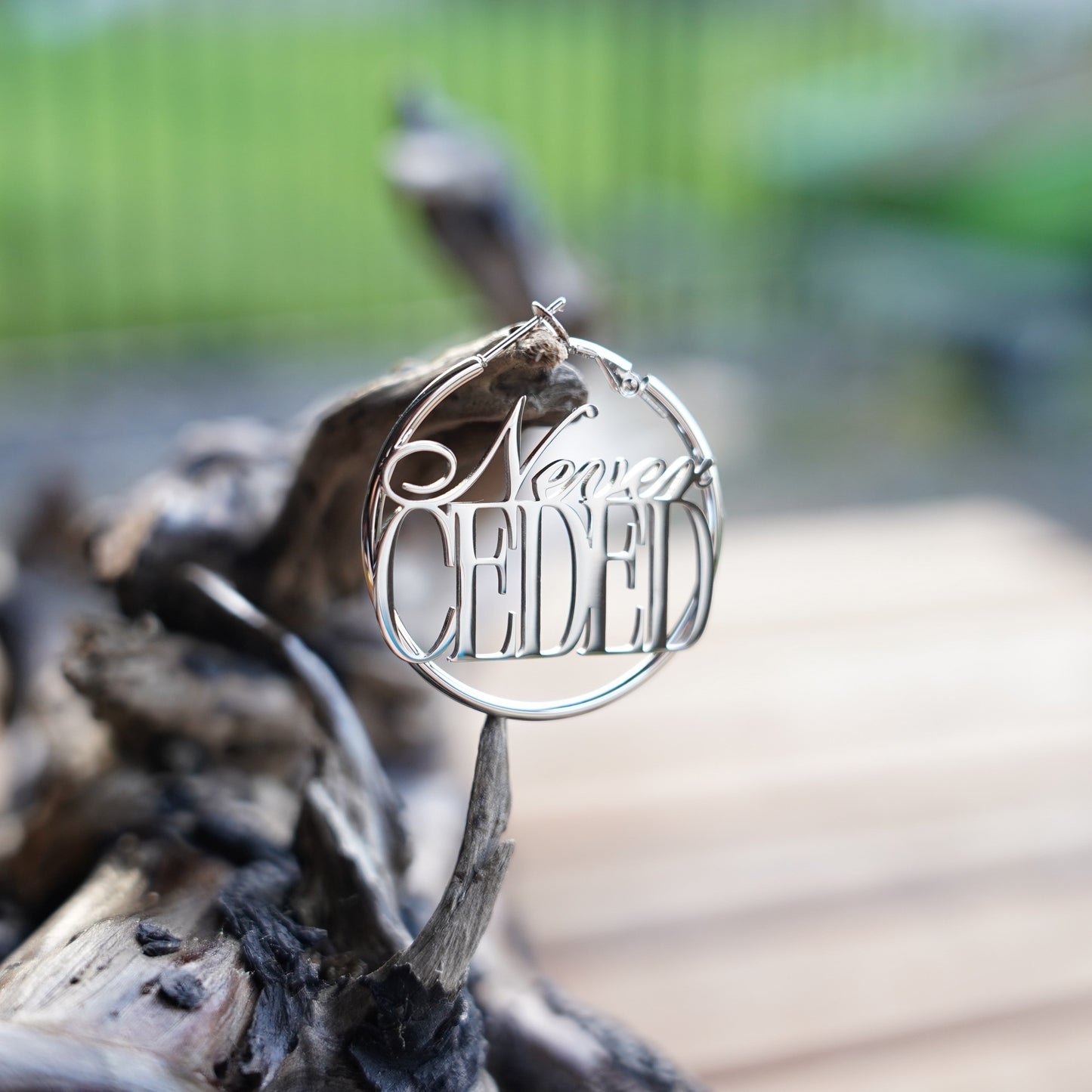 NEVER CEDED HOOP EARRINGS